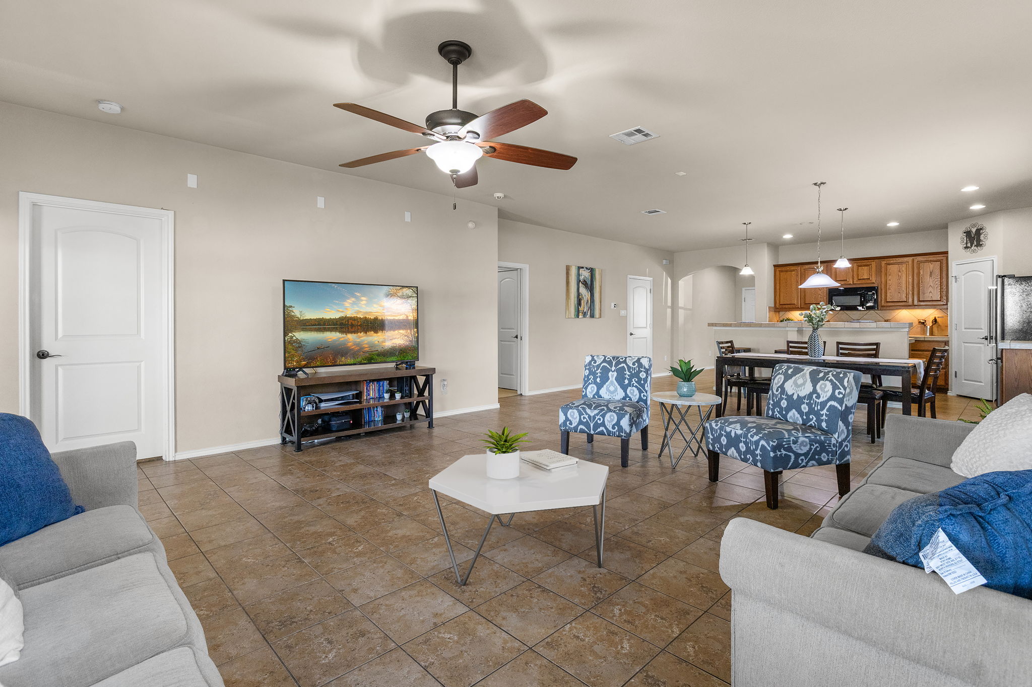 221 Blossom Valley Streme Buda, TX 78610 - Photo 10 of 40 a living room with furniture and kitchen view