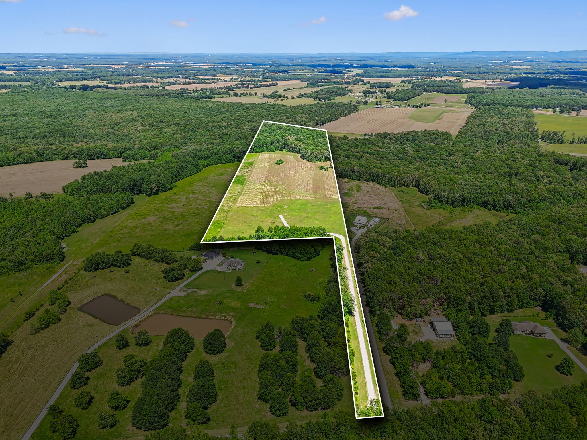 a view of a lake with a yard