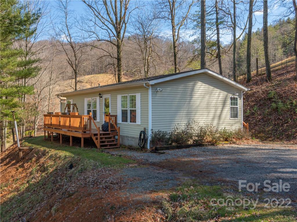 6232 Panther Creek Road Clyde, NC 28721 - Photo 1 of 25 a front view of a house with garden