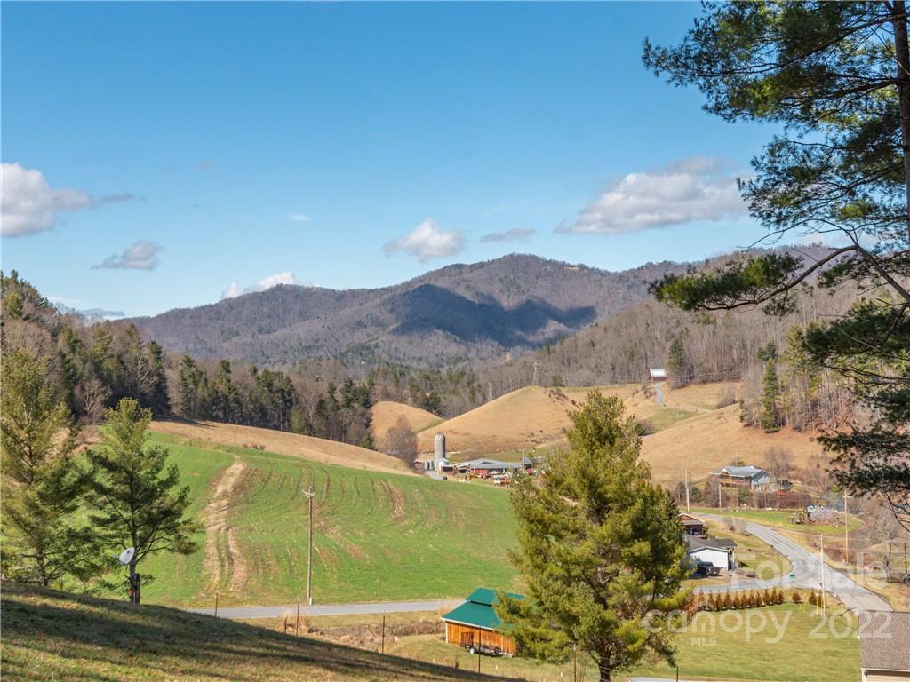 6232 Panther Creek Road Clyde, NC 28721 - Photo 20 of 25 a view of a lake with a mountain