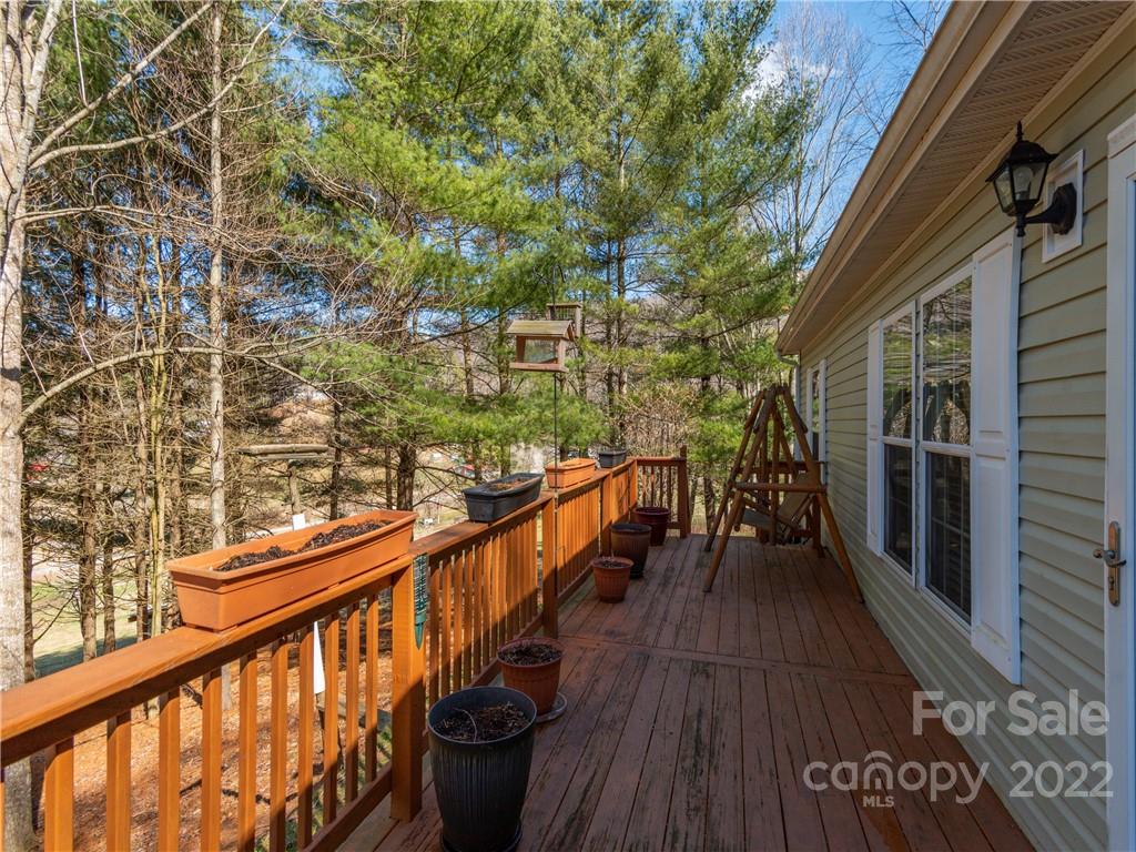 6232 Panther Creek Road Clyde, NC 28721 - Photo 2 of 25 a view of balcony with wooden floor