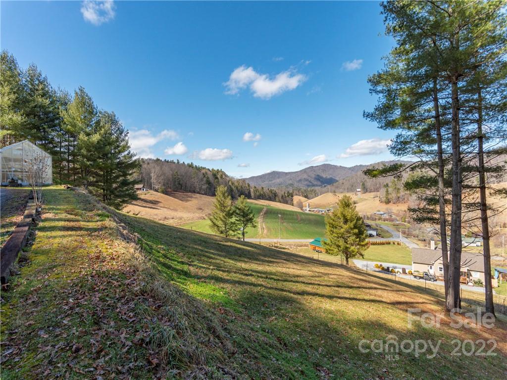 6232 Panther Creek Road Clyde, NC 28721 - Photo 3 of 25 a view of a lake with a mountain