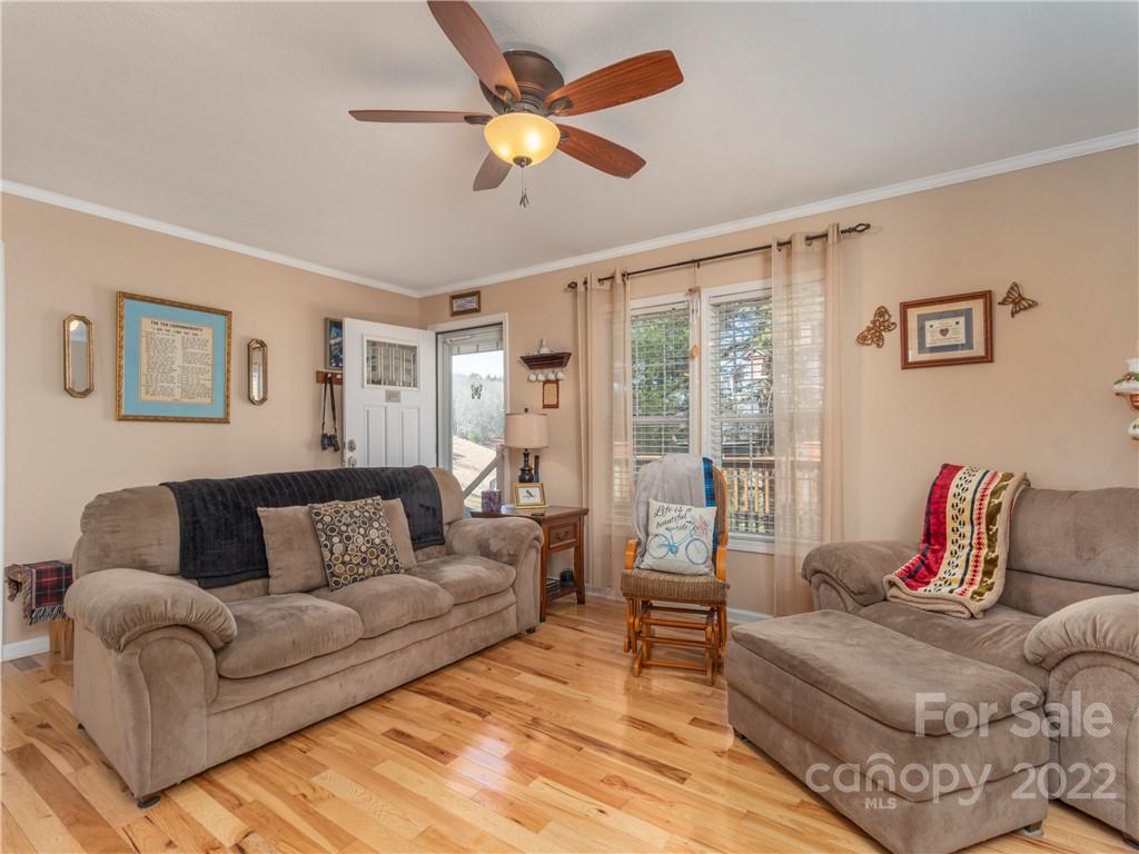 6232 Panther Creek Road Clyde, NC 28721 - Photo 5 of 25 a living room with furniture and a large window