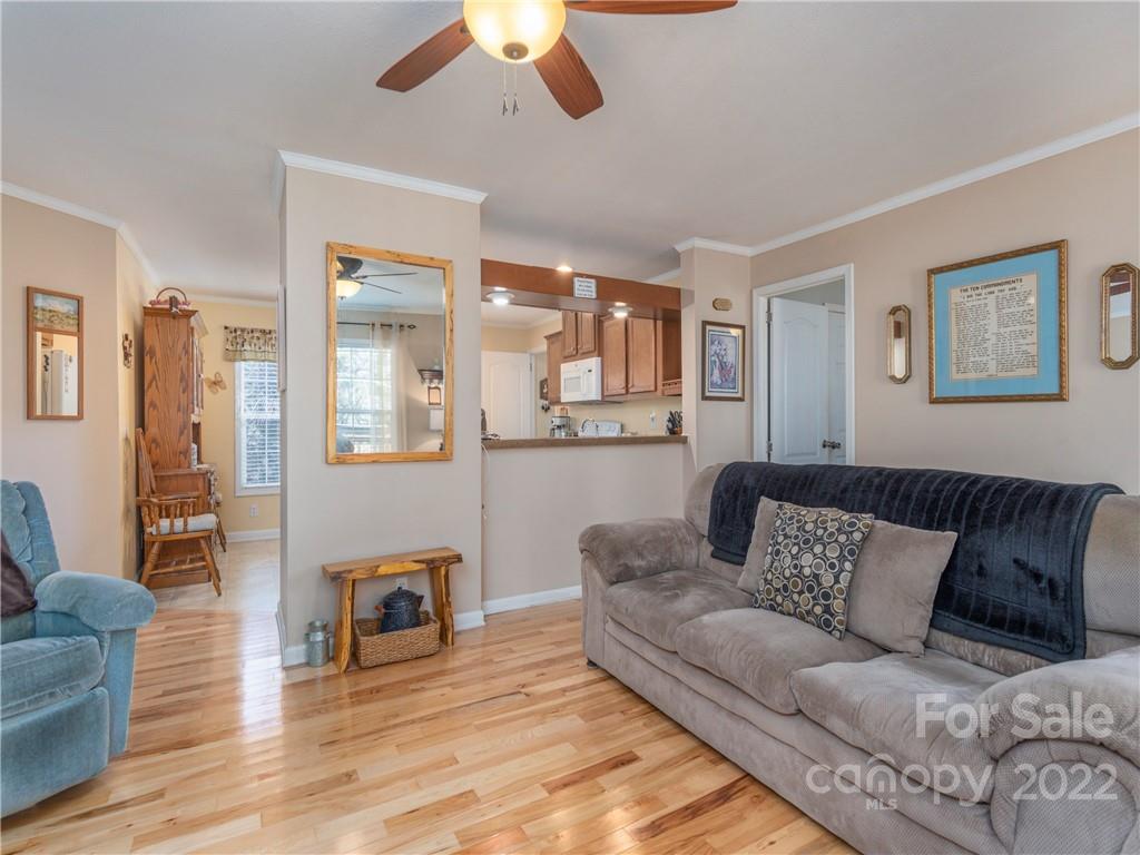 6232 Panther Creek Road Clyde, NC 28721 - Photo 6 of 25 a living room with furniture and a wooden floor