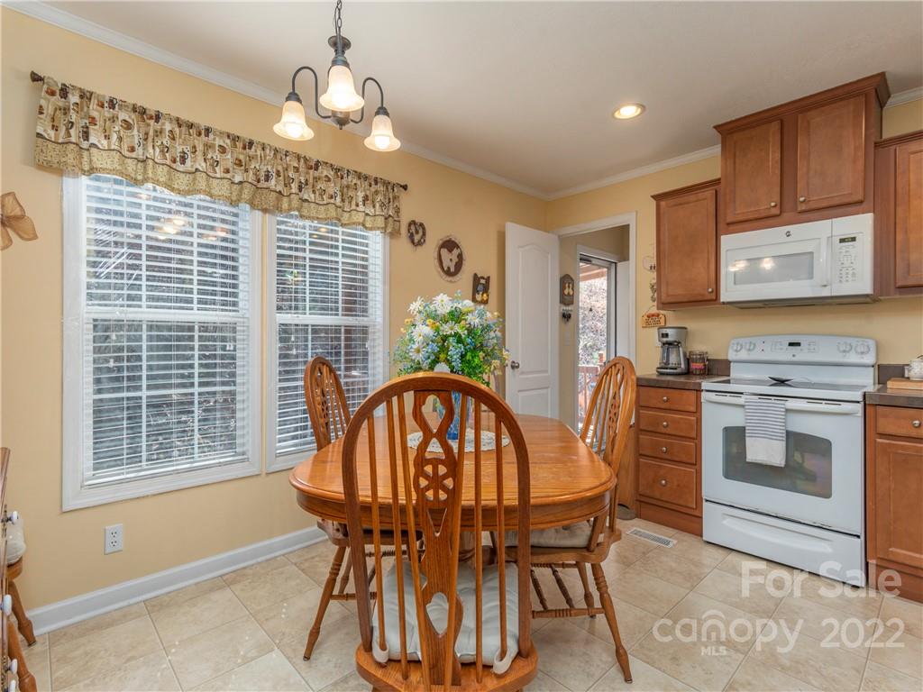 6232 Panther Creek Road Clyde, NC 28721 - Photo 7 of 25 a dining room with furniture and window