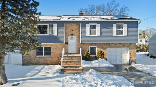 a view of a house with a yard and sitting space