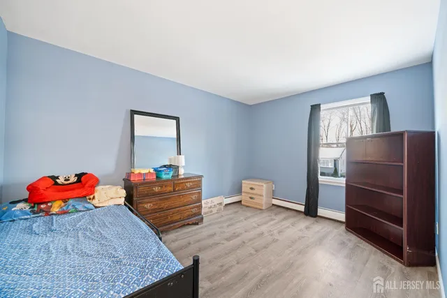 a bedroom with a bed and closet