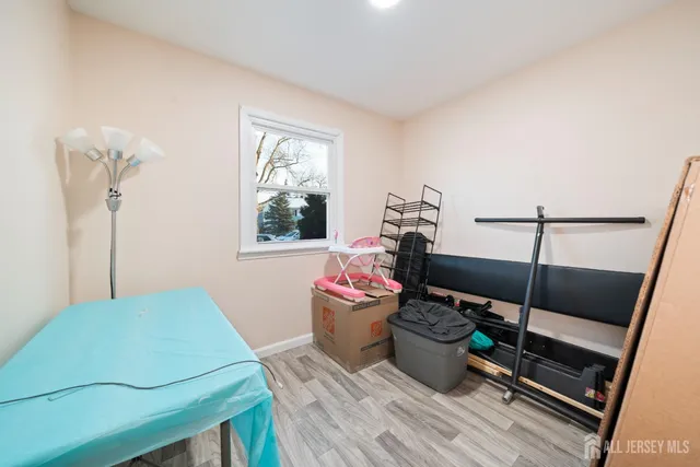 a bedroom with a bunkbed and window