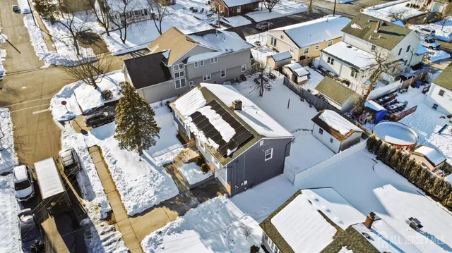 an aerial view of a house with roof