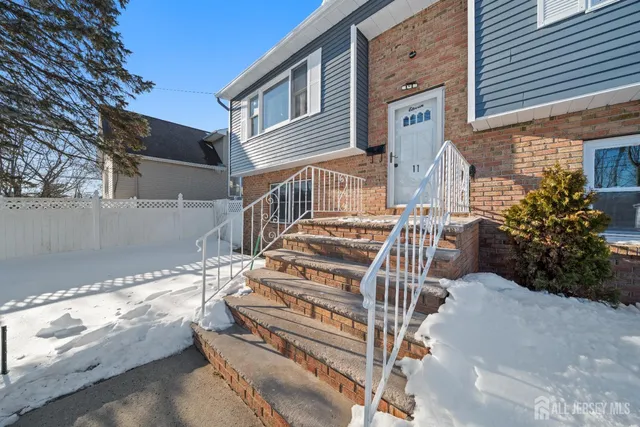 a view of a house with backyard and deck