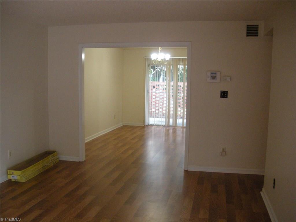 211 Northpoint Avenue, Unit G High Point, NC 27262 - Photo 2 of 21 Large Great Room with Laminate flooring.