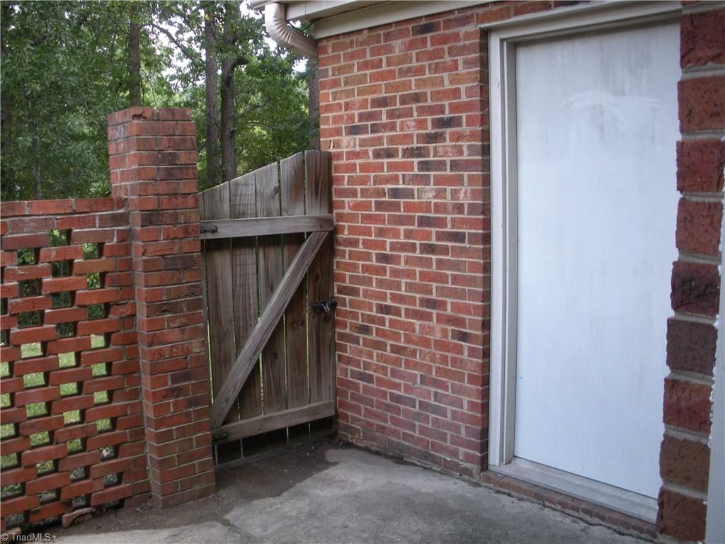 211 Northpoint Avenue, Unit G High Point, NC 27262 - Photo 11 of 21 Patio with storage unit. Washer/Dryer location.