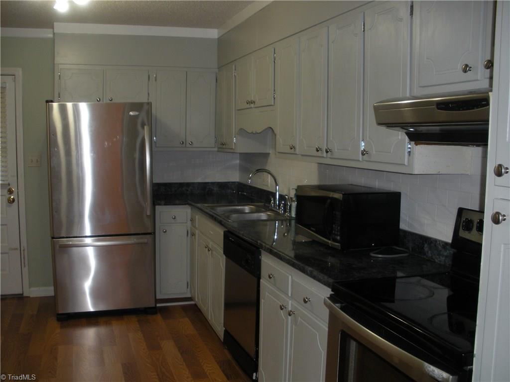 211 Northpoint Avenue, Unit G High Point, NC 27262 - Photo 8 of 21 Kitchen has lots of cabinets and counter space.