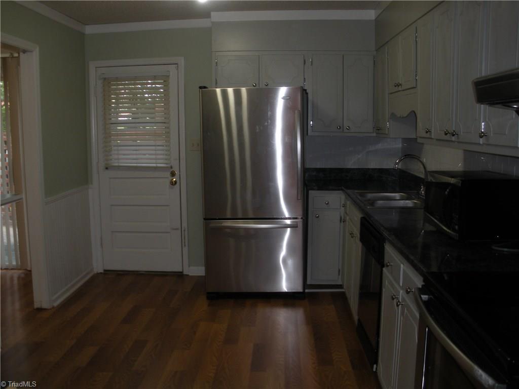 211 Northpoint Avenue, Unit G High Point, NC 27262 - Photo 9 of 21 Kitchen-Stainless Refrigerator stays with the property.