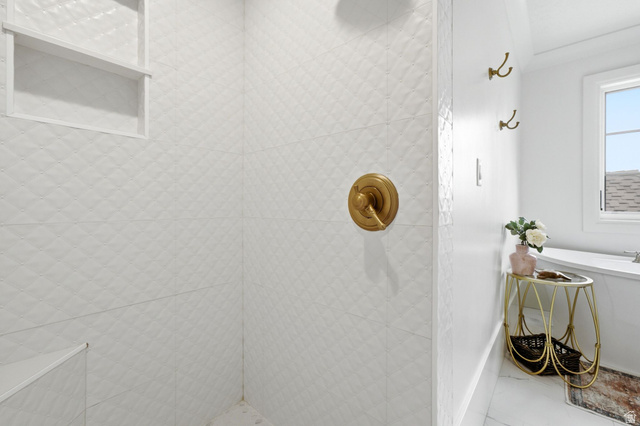 71 Farm Road Midway, UT 84049 - Photo 57 of 92 White tiled shower with a diamond pattern, featuring a built-in niche and a gold-finish shower control