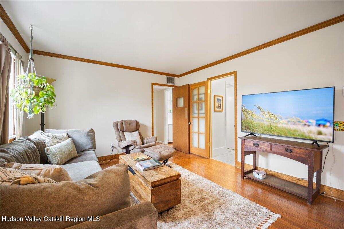 32 West Hurley Road, Unit ROUTE 375 Woodstock, NY 12498 - Photo 12 of 36 a living room with furniture and a flat screen tv