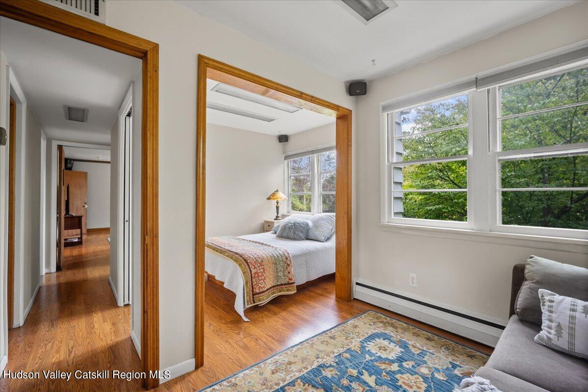 32 West Hurley Road, Unit ROUTE 375 Woodstock, NY 12498 - Photo 13 of 36 a bedroom with a bed and a window