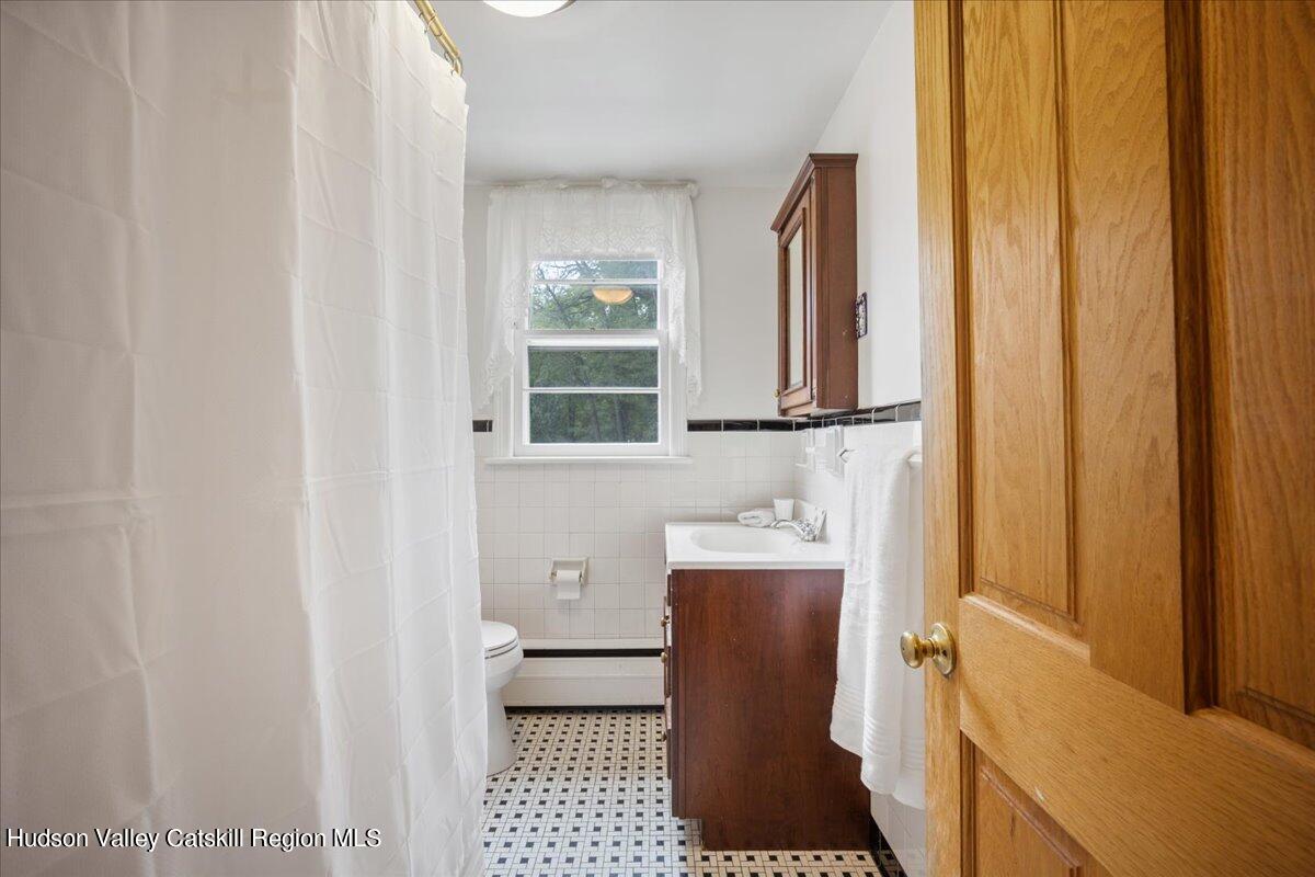 32 West Hurley Road, Unit ROUTE 375 Woodstock, NY 12498 - Photo 15 of 36 a bathroom with a sink toilet and shower