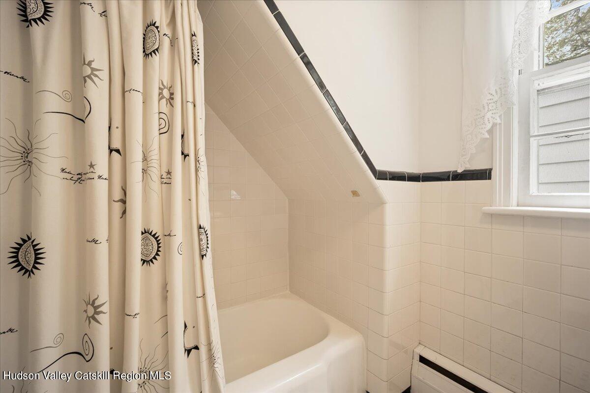 32 West Hurley Road, Unit ROUTE 375 Woodstock, NY 12498 - Photo 17 of 36 a bathroom with a bathtub