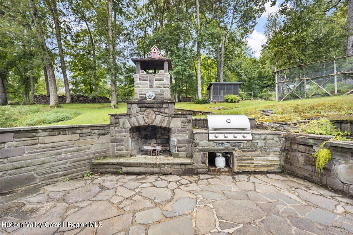 32 West Hurley Road, Unit ROUTE 375 Woodstock, NY 12498 - Photo 21 of 36 a front view of a house with garden