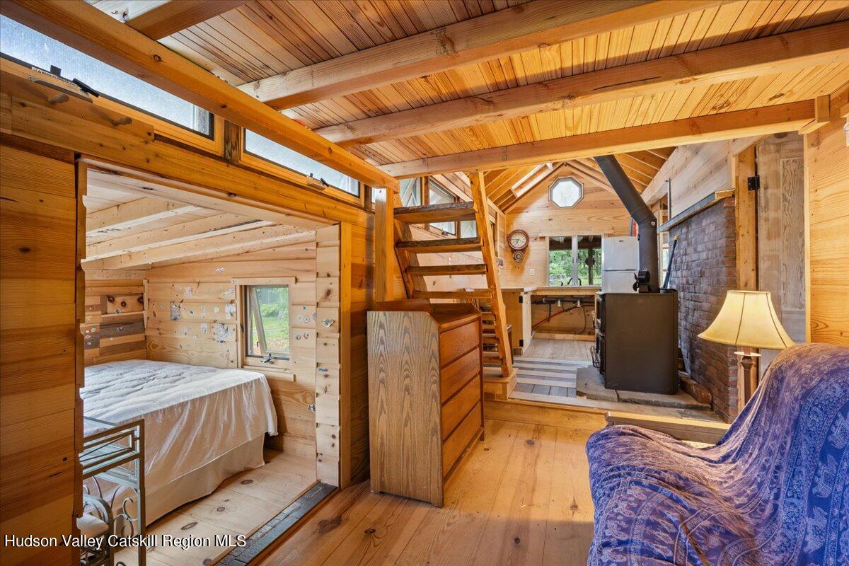 32 West Hurley Road, Unit ROUTE 375 Woodstock, NY 12498 - Photo 25 of 36 a bedroom with furniture and a window
