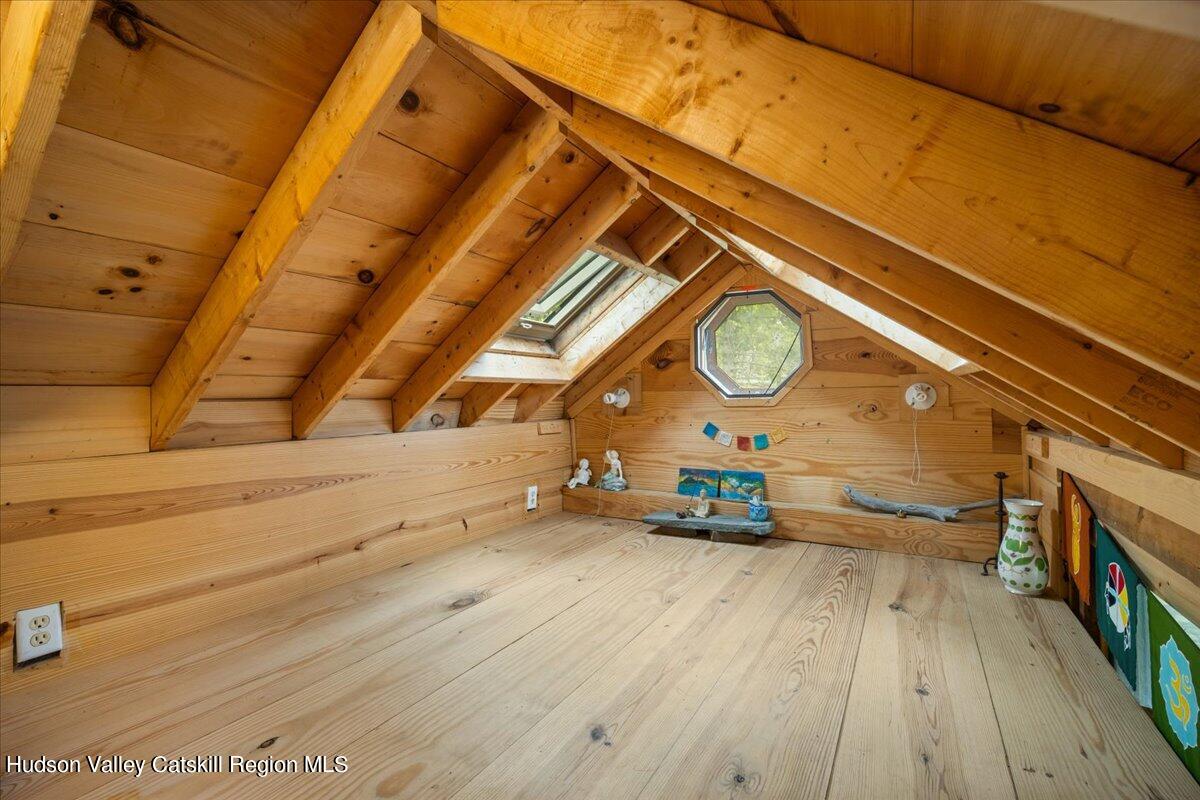 32 West Hurley Road, Unit ROUTE 375 Woodstock, NY 12498 - Photo 26 of 36 a view of a room with wooden floor and a ceiling fan