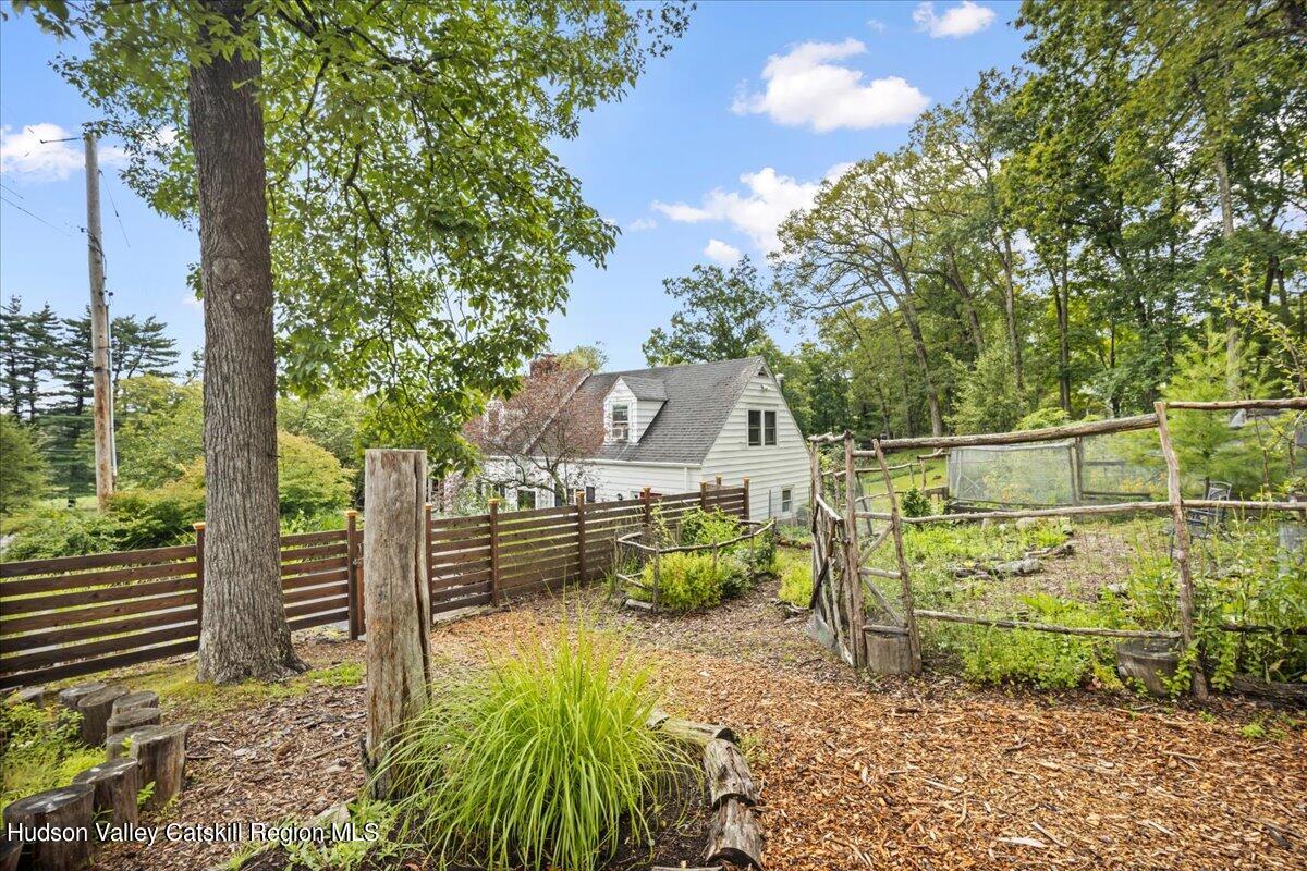 32 West Hurley Road, Unit ROUTE 375 Woodstock, NY 12498 - Photo 29 of 36 a backyard of a house with lots of green space