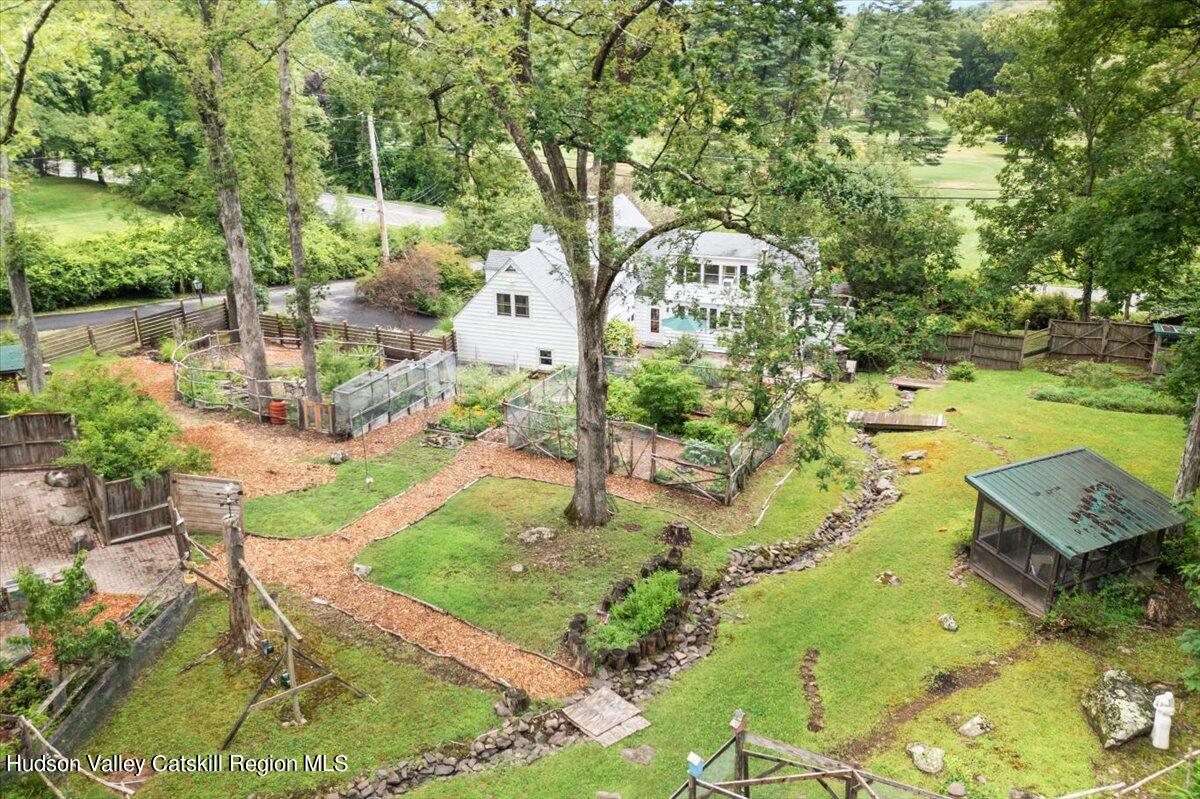 32 West Hurley Road, Unit ROUTE 375 Woodstock, NY 12498 - Photo 35 of 36 a view of a garden with an outdoor space