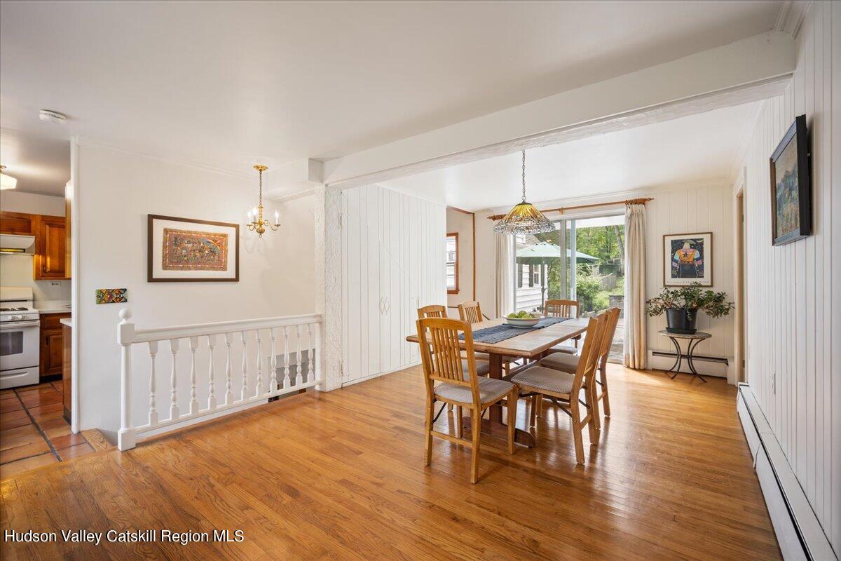 32 West Hurley Road, Unit ROUTE 375 Woodstock, NY 12498 - Photo 4 of 36 a view of a dining room with furniture and wooden floor
