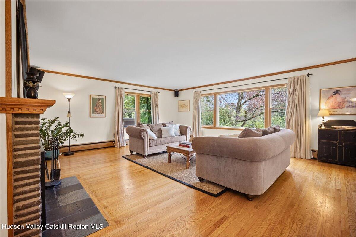 32 West Hurley Road, Unit ROUTE 375 Woodstock, NY 12498 - Photo 5 of 36 a living room with furniture and a large window