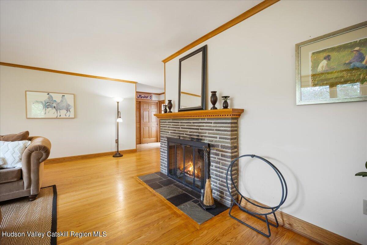 32 West Hurley Road, Unit ROUTE 375 Woodstock, NY 12498 - Photo 6 of 36 a living room with furniture and a fireplace