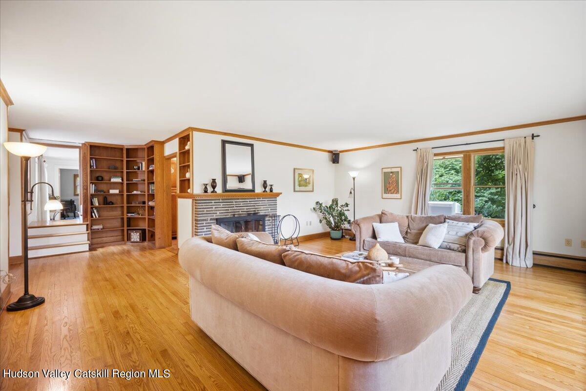 32 West Hurley Road, Unit ROUTE 375 Woodstock, NY 12498 - Photo 7 of 36 a living room with furniture and a large window
