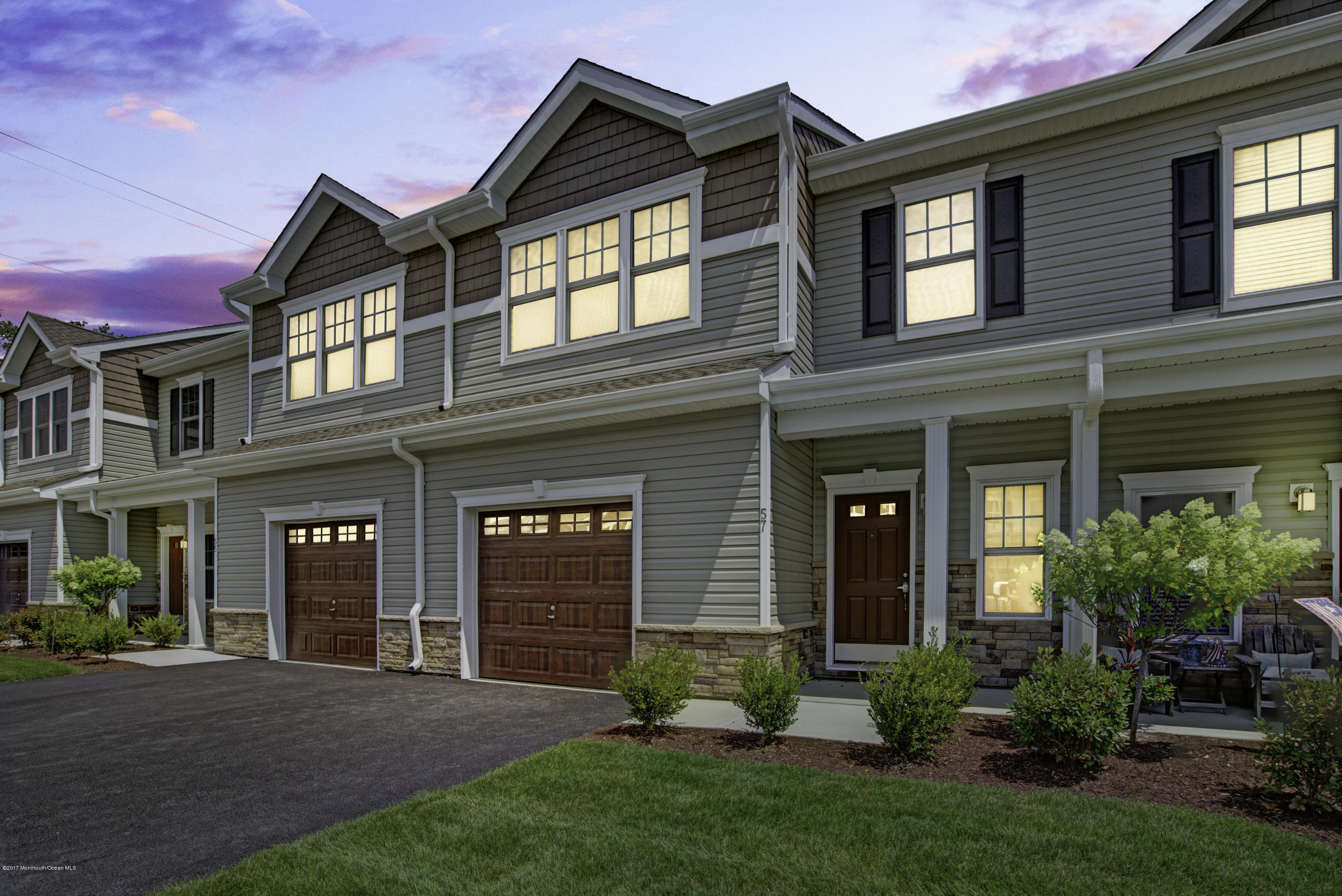 53 Rockingham Way Manchester Township, NJ 08759 - Photo 1 of 17 front view of a brick house with a yard