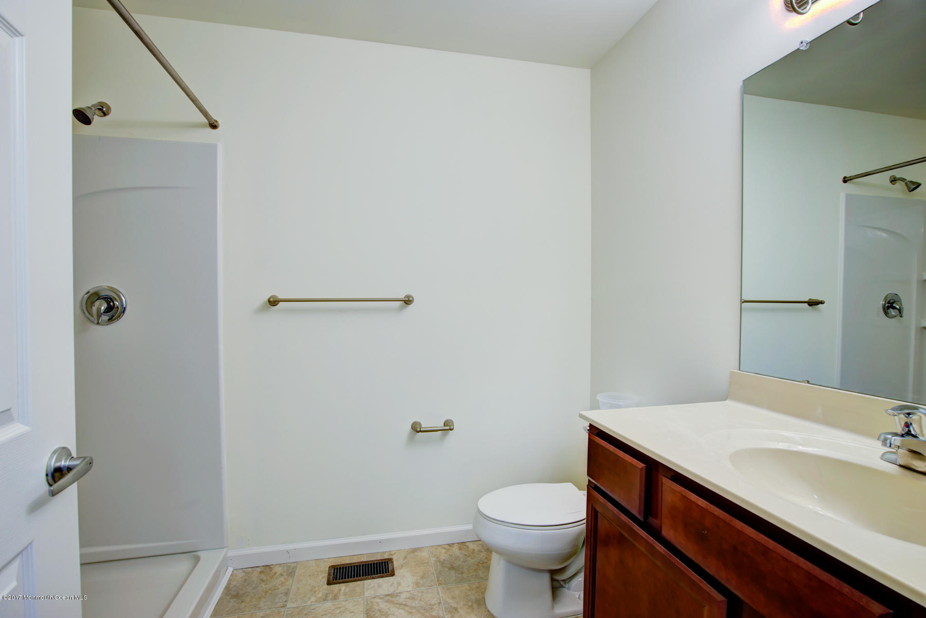 53 Rockingham Way Manchester Township, NJ 08759 - Photo 12 of 17 a bathroom with a sink a toilet and shower