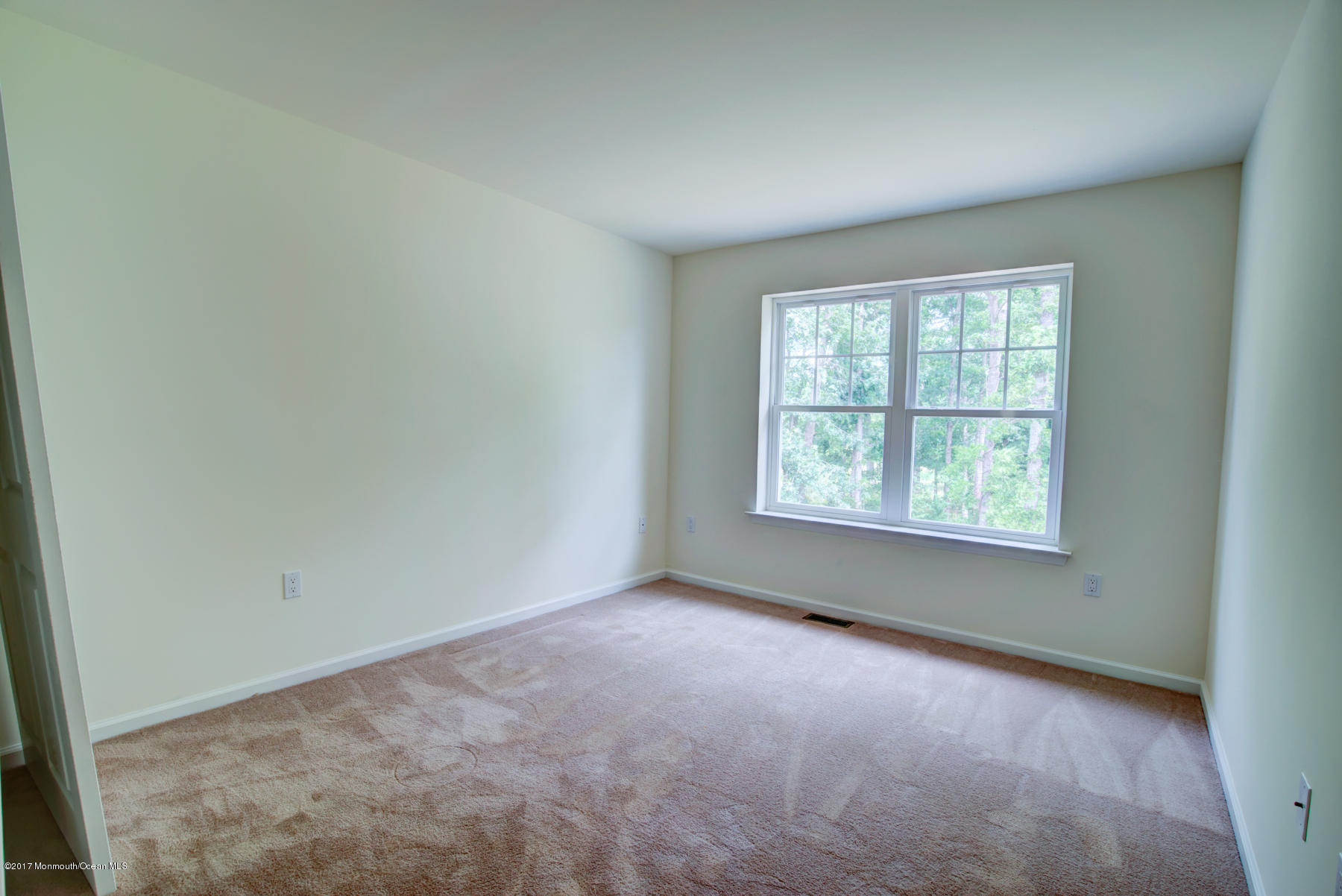 53 Rockingham Way Manchester Township, NJ 08759 - Photo 15 of 17 an empty room with windows