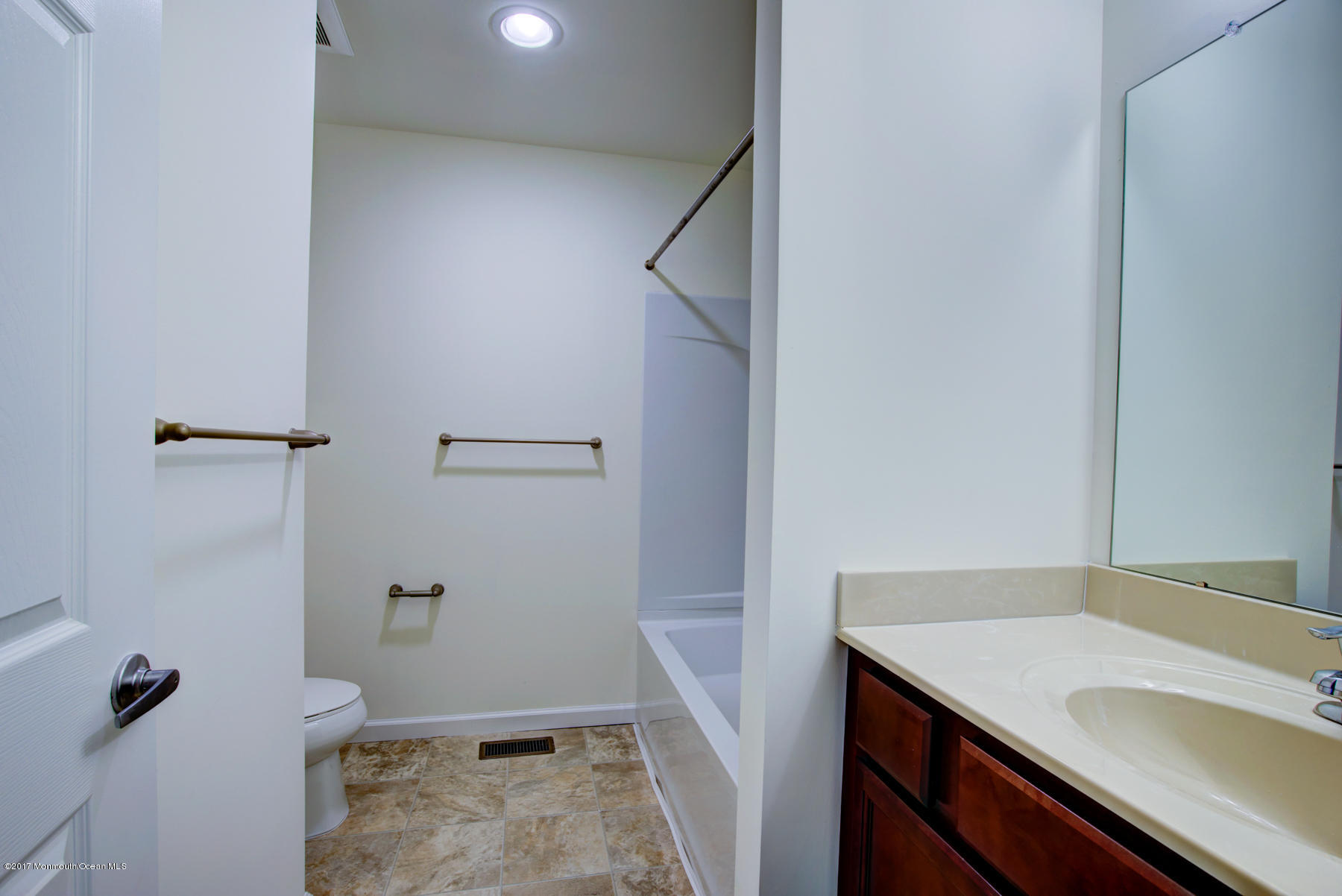 53 Rockingham Way Manchester Township, NJ 08759 - Photo 16 of 17 a bathroom with a sink and vanity
