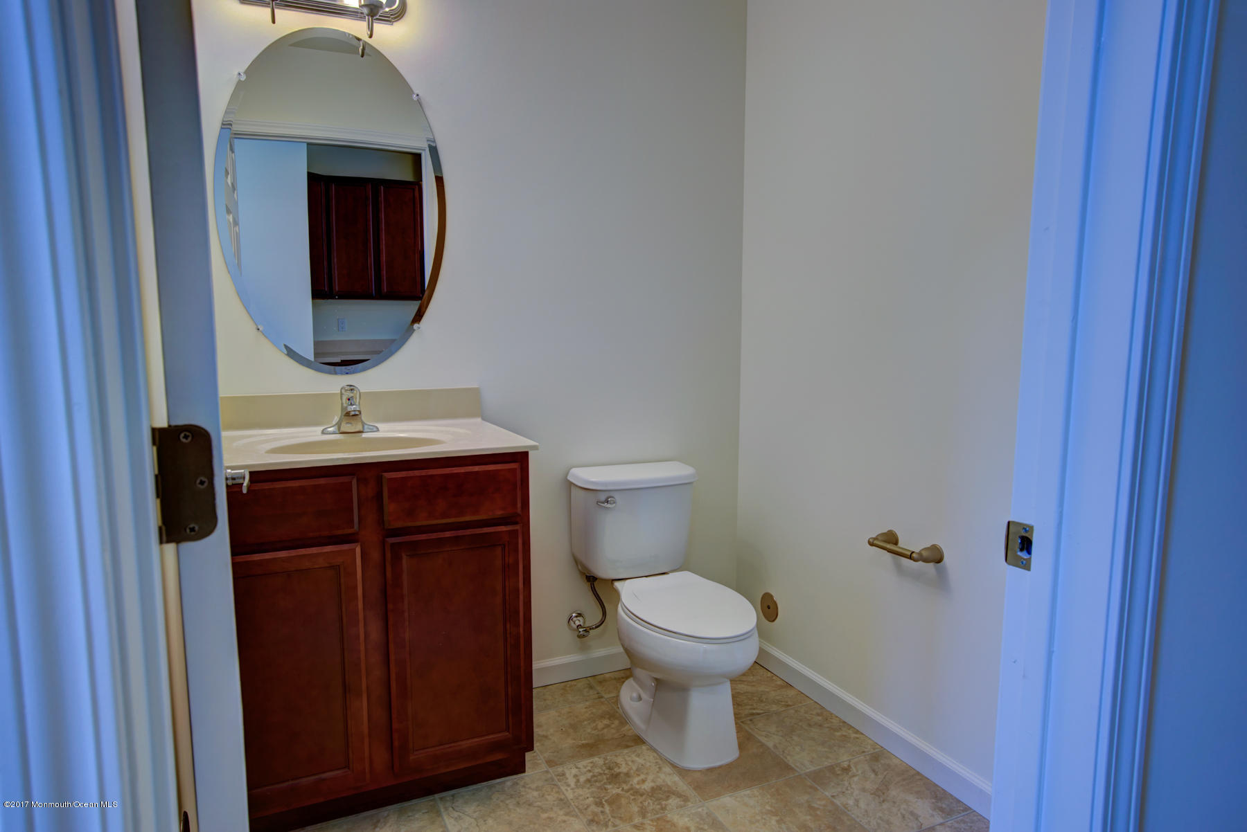 53 Rockingham Way Manchester Township, NJ 08759 - Photo 9 of 17 a bathroom with a toilet a sink and mirror