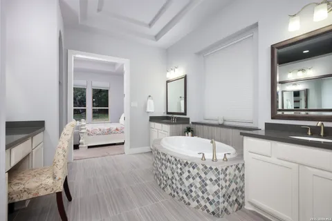 a bathroom with a shower and a sink