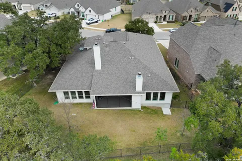 an aerial view of a house with a swimming pool
