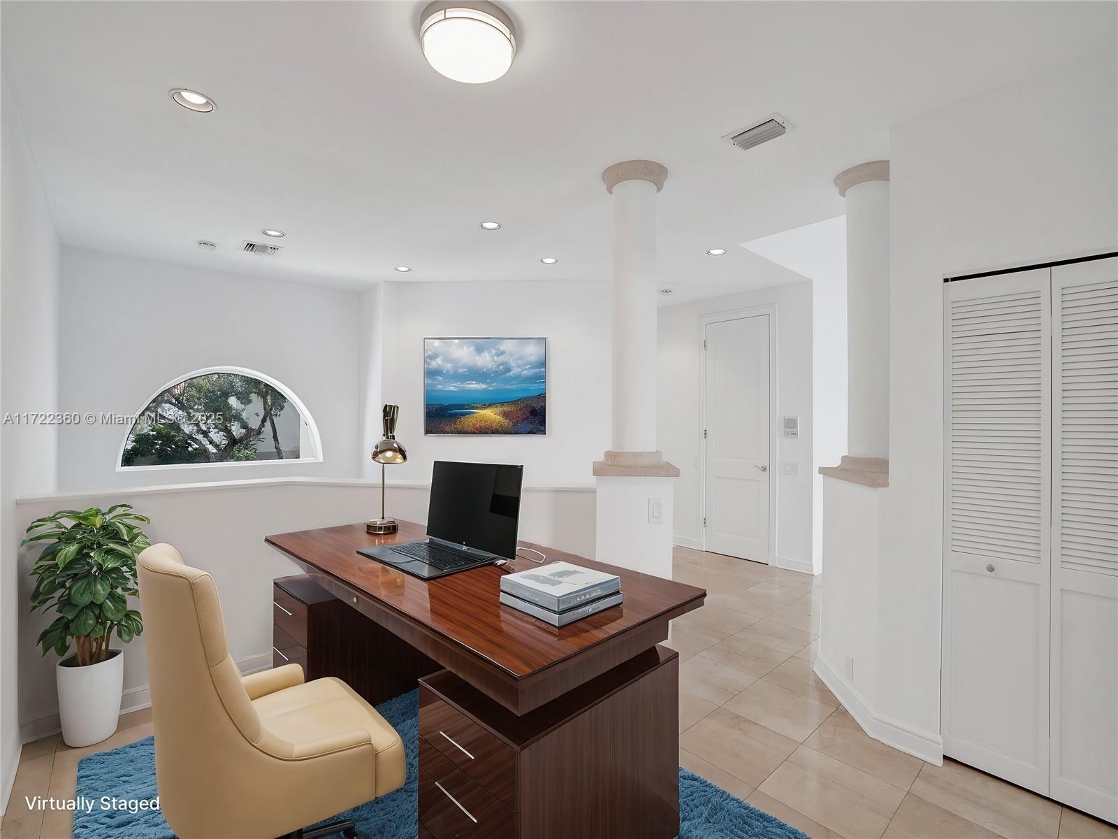 8850 Southwest 67th Court Pinecrest, FL 33156 - Photo 15 of 49 a living room with furniture a rug and a wall painting