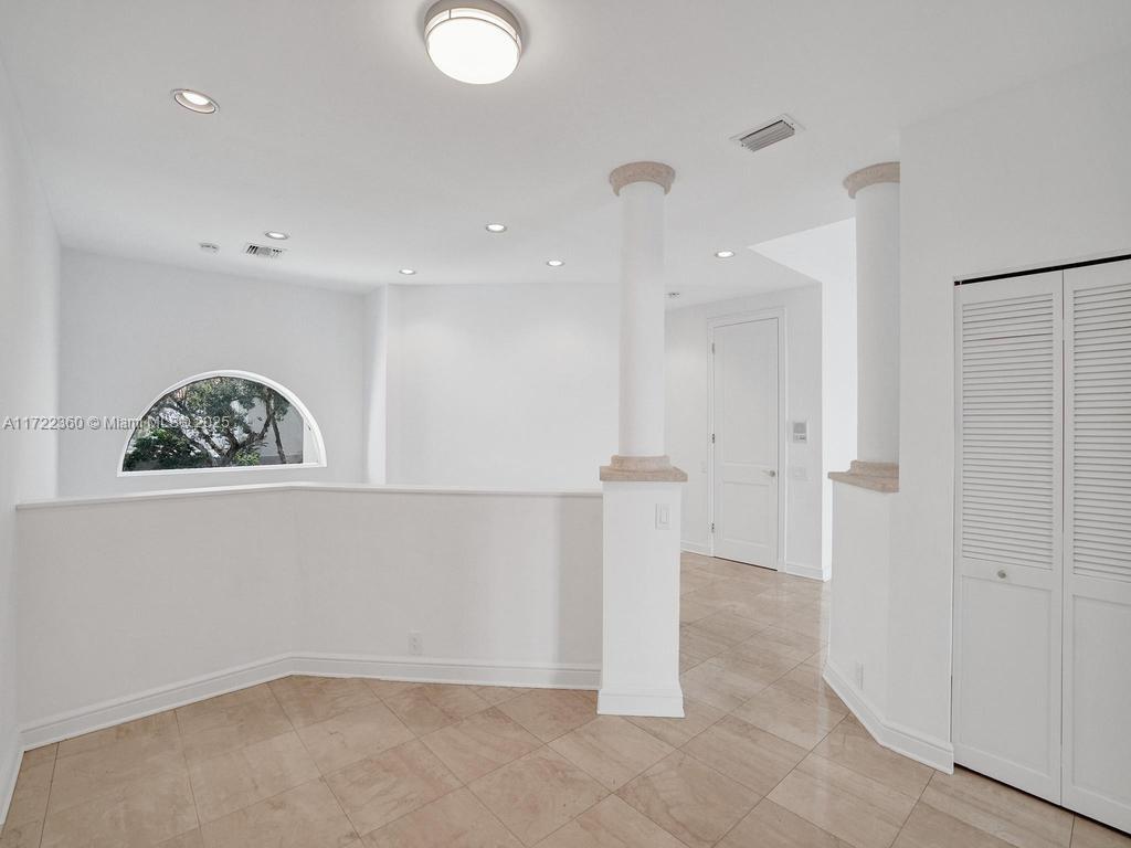 8850 Southwest 67th Court Pinecrest, FL 33156 - Photo 16 of 49 a view of an empty room with wooden floor