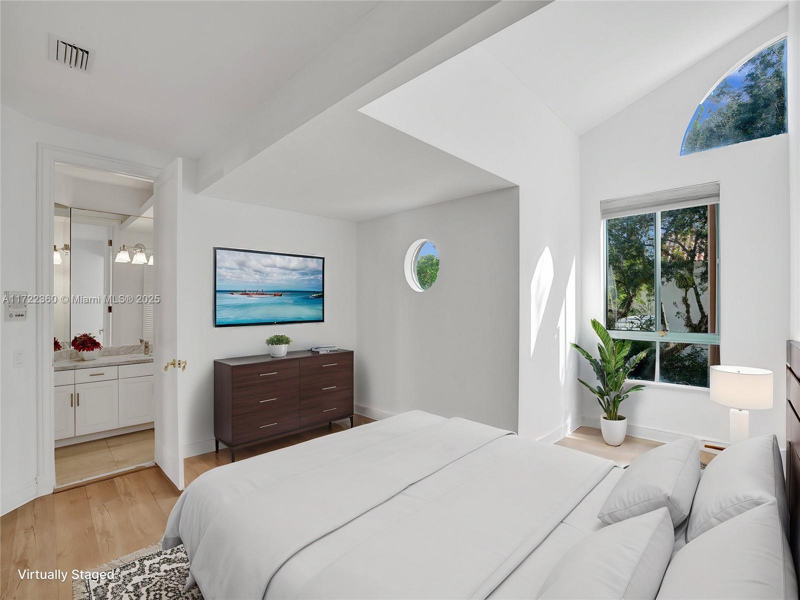 8850 Southwest 67th Court Pinecrest, FL 33156 - Photo 20 of 49 a bedroom with a bed and a dresser