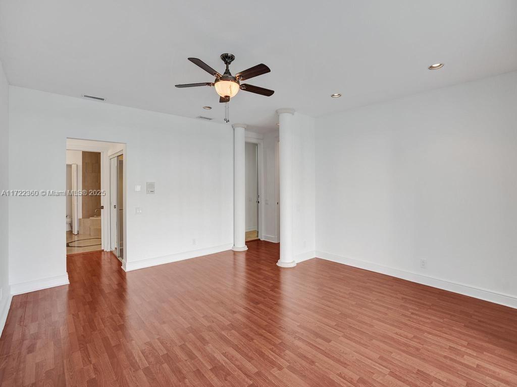 8850 Southwest 67th Court Pinecrest, FL 33156 - Photo 26 of 49 a view of an empty room with wooden floor
