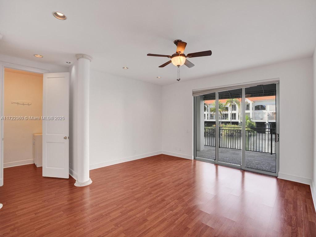 8850 Southwest 67th Court Pinecrest, FL 33156 - Photo 27 of 49 wooden floor in an empty room with a window