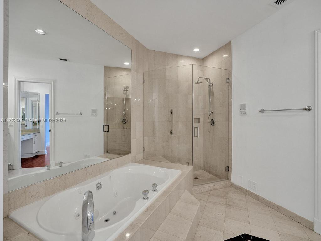 8850 Southwest 67th Court Pinecrest, FL 33156 - Photo 30 of 49 a bathroom with a bathtub shower and a sink