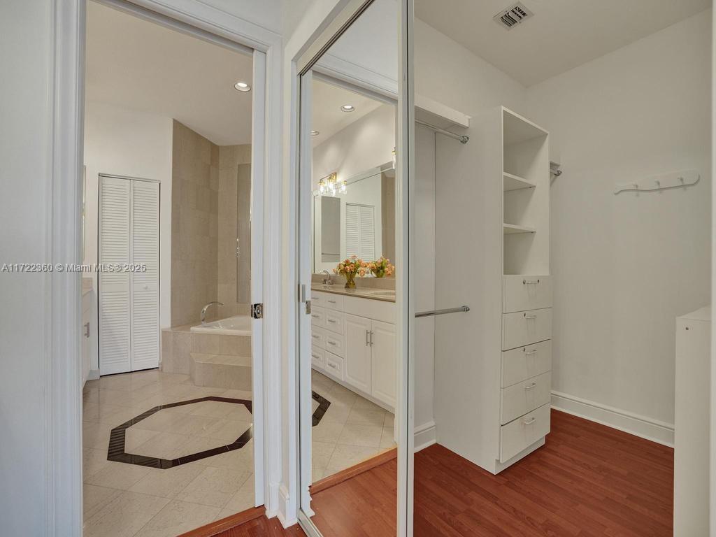 8850 Southwest 67th Court Pinecrest, FL 33156 - Photo 31 of 49 a bathroom with a tub and shower