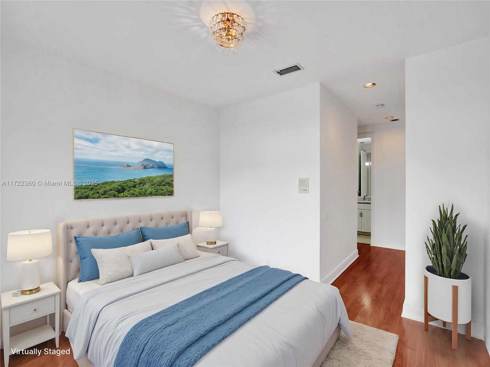 8850 Southwest 67th Court Pinecrest, FL 33156 - Photo 32 of 49 a bedroom with a bed and a potted plant