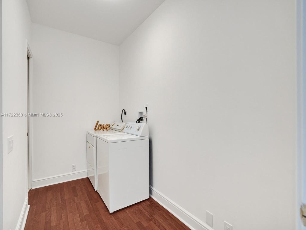 8850 Southwest 67th Court Pinecrest, FL 33156 - Photo 38 of 49 a utility room with wooden floor washer and dryer