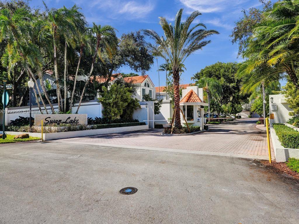 8850 Southwest 67th Court Pinecrest, FL 33156 - Photo 4 of 49 a view of street with cars