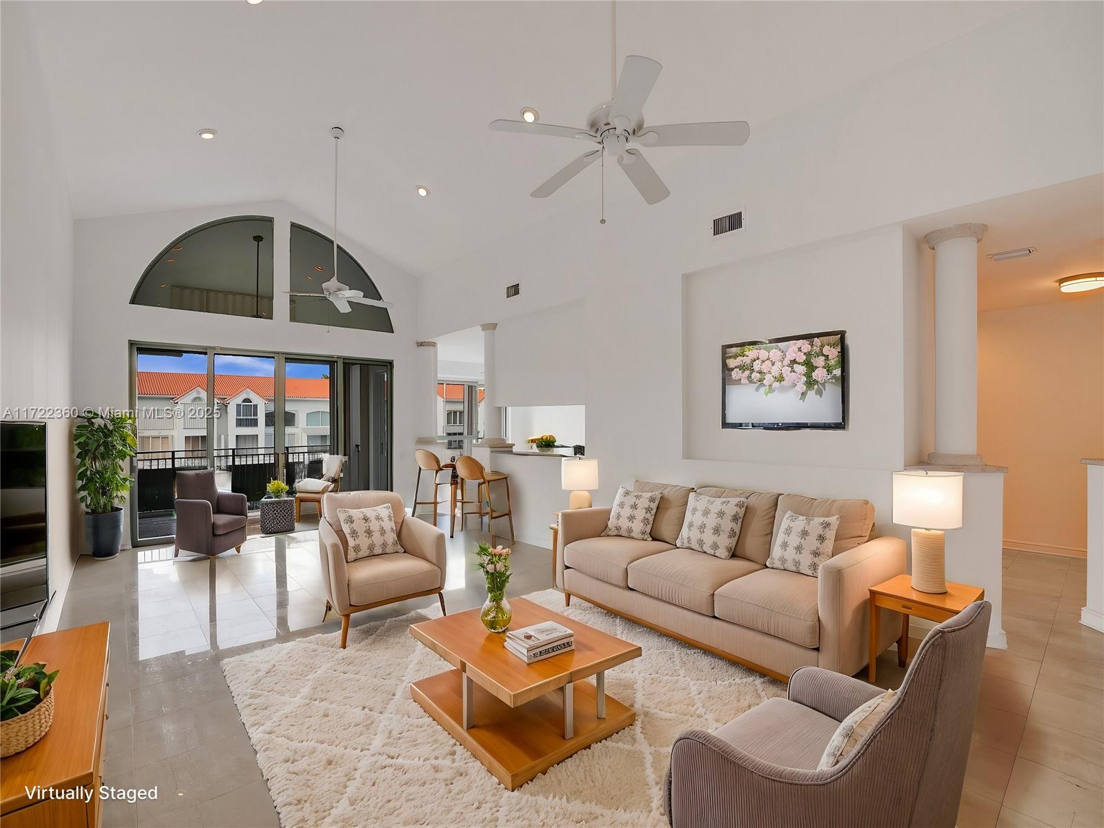 8850 Southwest 67th Court Pinecrest, FL 33156 - Photo 10 of 49 a living room with furniture ceiling fan and a rug